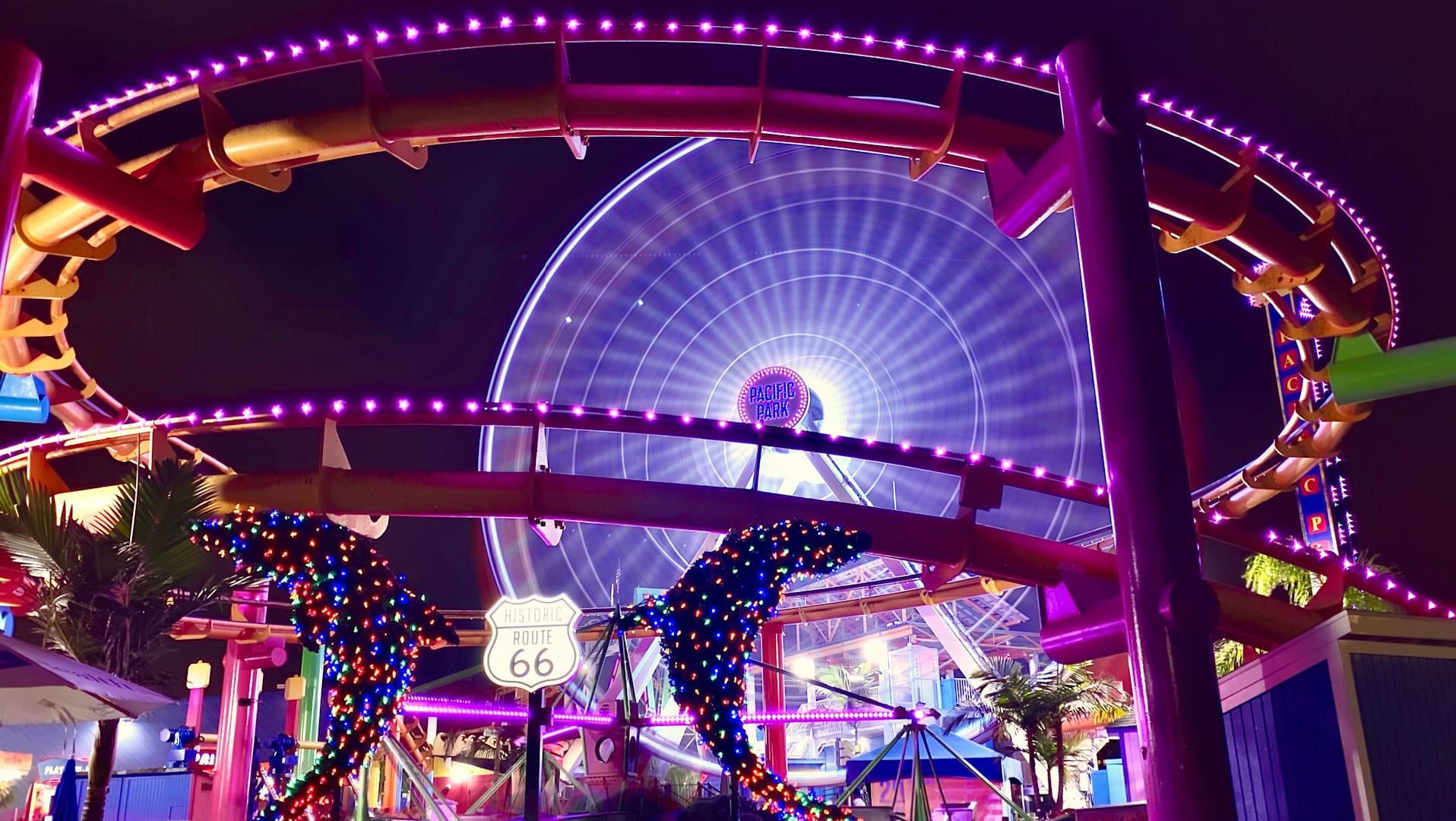 A ferris wheel with lights and people in it